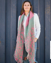 Load image into Gallery viewer, Picture shows our range of Fun Cozy Winter Scarves - in 7 colour ways. This one the Pink Green animal print Option. This acrylic blend wonder is super soft, non-bulky, and an extra layer of warmth for the season. In a stylish check pattern, it&#39;s the perfect partner for your winter ensemble. The rectangle shape with frayed angled edges adds that finishing touch.
