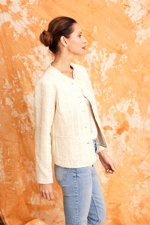 Image shows the side of The classic Chanel StyleI the Jamila Jacket in Cream from Kamare worn over jeans, Available in sizes 8, 10, 12 and 14 at Millthorpe Blue