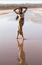 Load image into Gallery viewer, Lilly Pilly Jade Cashmere Cardigan in Oatmeal worn by woman on Byron Bay beach
